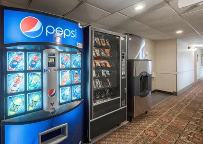 a pepsi machine in a lobby with a soda at Red Roof Inn & Suites Mt Holly - McGuire AFB in Westampton Township