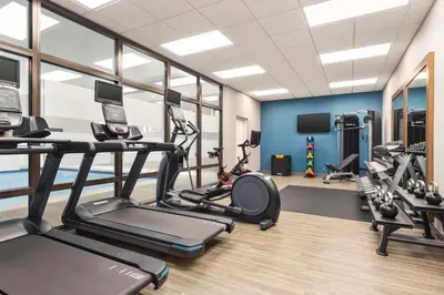 a gym with treadmills and elliptical machines at Hampton Inn Quakertown in Quakertown