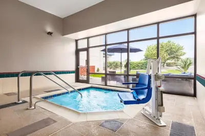 a indoor swimming pool with a slide in a building at Hampton Inn Quakertown in Quakertown