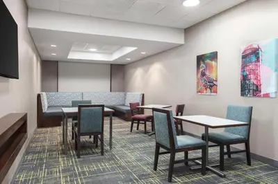 a waiting room at a hospital with tables and chairs at Hampton Inn Quakertown in Quakertown