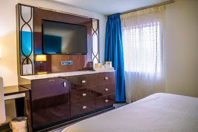 a bedroom with a dresser with a tv on it at Inn at York in York