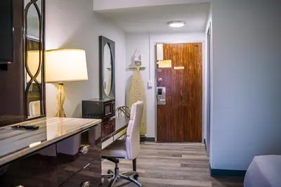 a room with a desk with a chair and a door at Inn at York in York