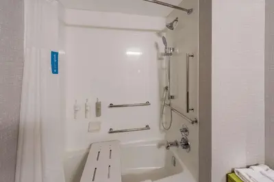 a bathroom with a shower and a bath tub at Hampton Inn Nanuet in Nanuet