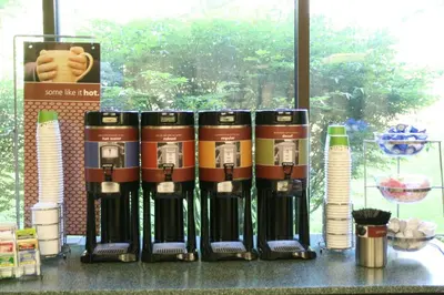 a group of wine bottles sitting on a table at Hampton Inn Selinsgrove/Shamokin Dam in Shamokin Dam