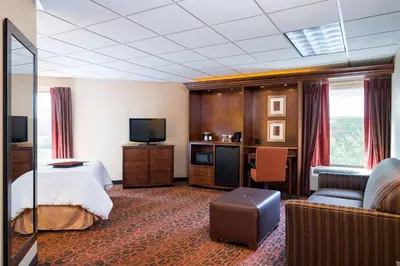 a hotel room with a bed and a television at Hampton Inn Selinsgrove/Shamokin Dam in Shamokin Dam