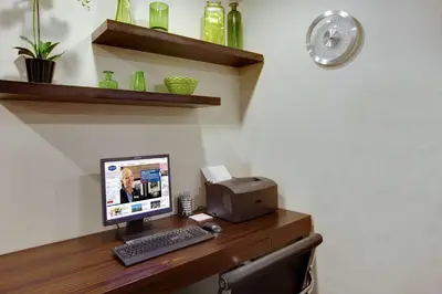 a desk with a computer and a printer on it at Hampton Inn Harrisburg/Grantville/Hershey in Grantville