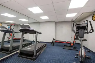 a gym with two tread machines in a room at Quality Inn Near Princeton in Lawrence
