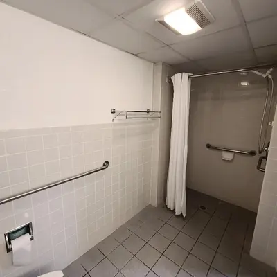 a bathroom with a shower and a shower curtain at Town Inn in Bordentown