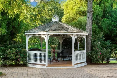 a white gazebo with a clock on top at Exton Hotel and Conference Center in Exton