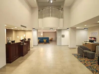 a lobby of a hospital with a waiting room at Hampton Inn and Suites of Lamar in Mill Hall