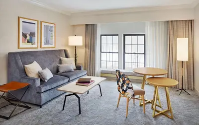 a living room with a couch and a table at Hilton Pearl River in Pearl River