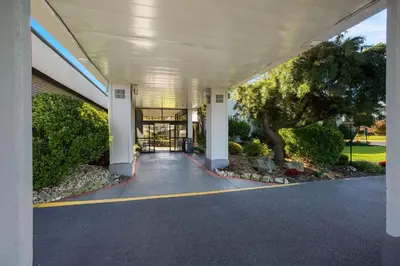 an empty entrance to a building with a tree at Quality Inn Wayne - Fairfield Area in Wayne