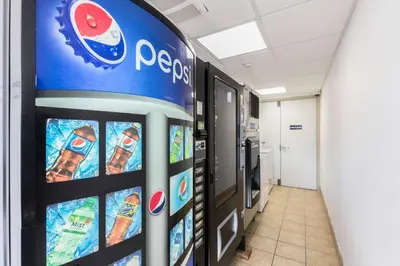 a pepsi machine in a hospital hallway at Motel 6 New Brunswick in New Brunswick
