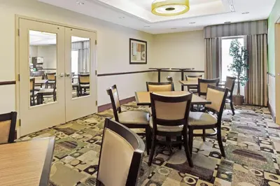 a dining room with a table and chairs at La Quinta by Wyndham Lancaster in Lancaster