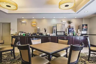 a dining room with a table and chairs at La Quinta by Wyndham Lancaster in Lancaster