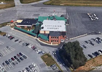 an aerial view of a parking lot with cars parked at Motel 6 Lancaster in Lancaster