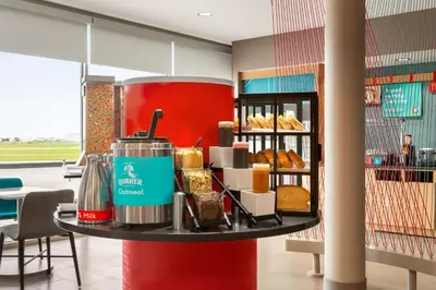a counter with bread and other food items on it at avid hotels - Lancaster by IHG in Lancaster