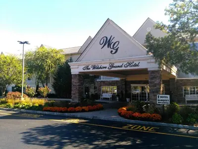 a wisma grand hotel front of a building at The Wilshire Grand Hotel in West Orange