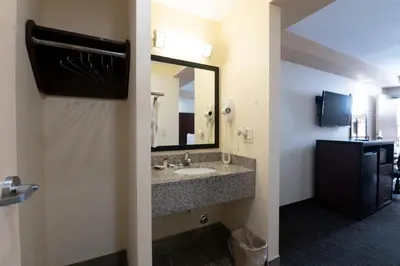 a bathroom with a sink and a mirror at Knights Inn South Amboy in South Amboy