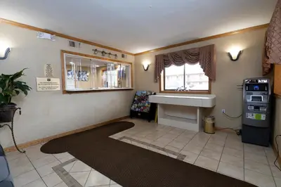 a living room with a sink and a window at Knights Inn South Amboy in South Amboy