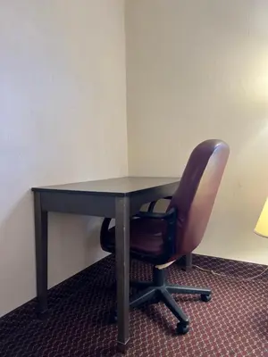 an office desk with a chair and a table at Olde Amish Inn in Ronks
