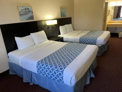 a hotel room with two beds in a room at Olde Amish Inn in Ronks