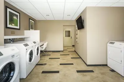 a laundry room with a washer and dryer at Candlewood Suites Bensalem - Philadelphia Area by IHG in Bensalem