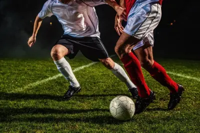 two men playing a game of soccer on a field at Candlewood Suites Bensalem - Philadelphia Area by IHG in Bensalem