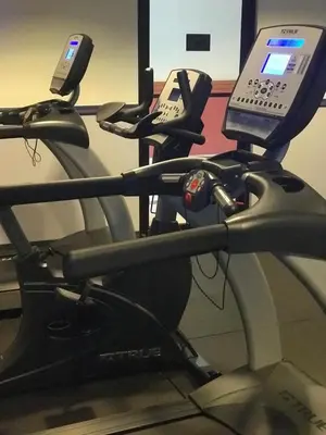 a cell phone sitting on a treadmill with a cell phone at Meadowlands Plaza Hotel in Secaucus