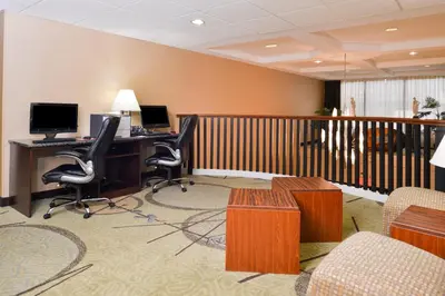 an office with a desk and chairs and a computer at Holiday Inn Express Hotel & Suites West Chester by IHG in West Chester