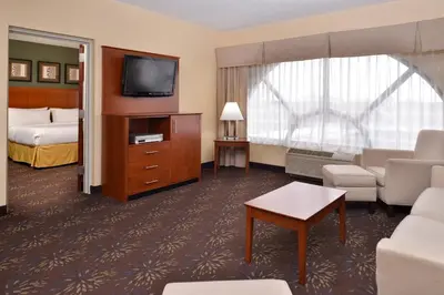a hotel room with a bed and a television at Holiday Inn Express Hotel & Suites West Chester by IHG in West Chester