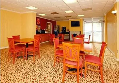 a dining room with wooden tables and chairs at Inn at Monticello in Monticello