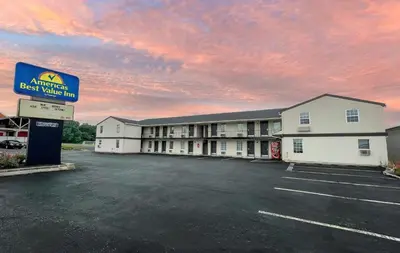 an empty parking lot in front of a hotel at America's Best Value Inn Lancaster in Lancaster
