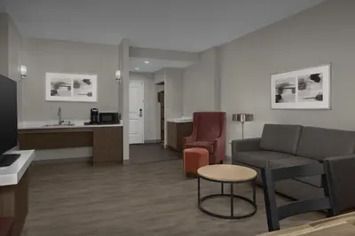 a living room with a couch and a table at Hilton Garden Inn Philadelphia-Fort Washington in Fort Washington