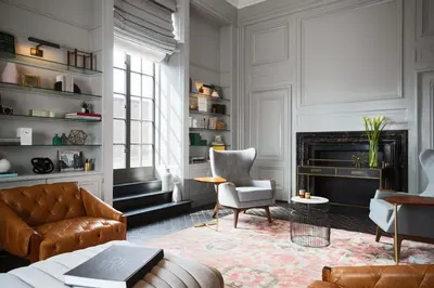 a living room with a couch and a fireplace at Kimpton Hotel Palomar Philadelphia by IHG in Philadelphia