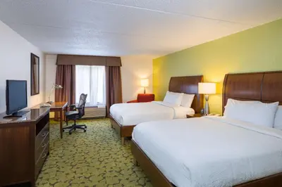a hotel room with two beds and a television at Hilton Garden Inn Edison/Raritan Center in Edison