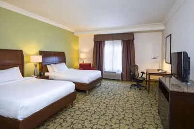 a hotel room with two beds and a television at Hilton Garden Inn Edison/Raritan Center in Edison