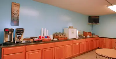 a kitchen with orange cabinets and a counter top at Eastbrook Inn in Ronks