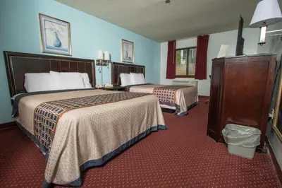 a hotel room with two beds in a room at Eastbrook Inn in Ronks