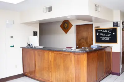 a bar in a restaurant with a chalkboard on the wall at Eastbrook Inn in Ronks