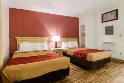 a room with two beds in a hotel room at Econo Lodge Inn & Suites Lake Harmony - Pocono Mountains Area in White Haven