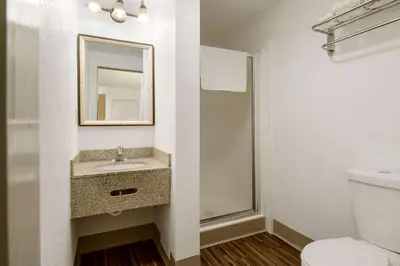 a bathroom with a sink and a shower at Econo Lodge Inn & Suites Lake Harmony - Pocono Mountains Area in White Haven
