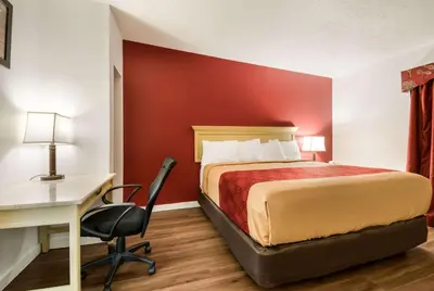 a hotel room with a bed and a desk and a computer at Econo Lodge Inn & Suites Lake Harmony - Pocono Mountains Area in White Haven