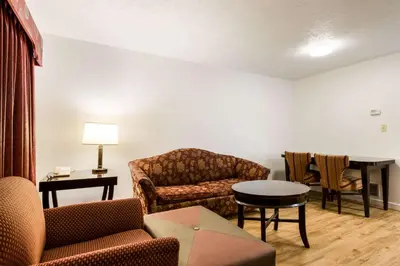 a living room with a couch and a table at Econo Lodge Inn & Suites Lake Harmony - Pocono Mountains Area in White Haven