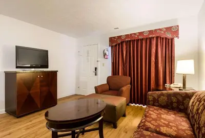 a living room with a couch and a table at Econo Lodge Inn & Suites Lake Harmony - Pocono Mountains Area in White Haven