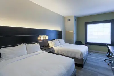 a hotel room with two beds and a window at Holiday Inn Express Hotel & Suites Reading by IHG in Reading