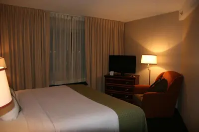 a hotel room with a bed and a television at Holiday Inn Budd Lake - Rockaway Area by IHG in Budd Lake