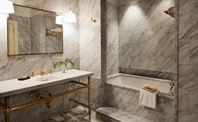 a bathroom with a sink and a shower at The Greenwich Hotel in New York