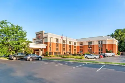 a large building with cars parked in a parking lot at Comfort Inn & Suites Newark - Wilmington in Newark