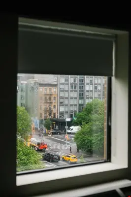 a view of a city street from a window at The Gatsby Hotel in New York